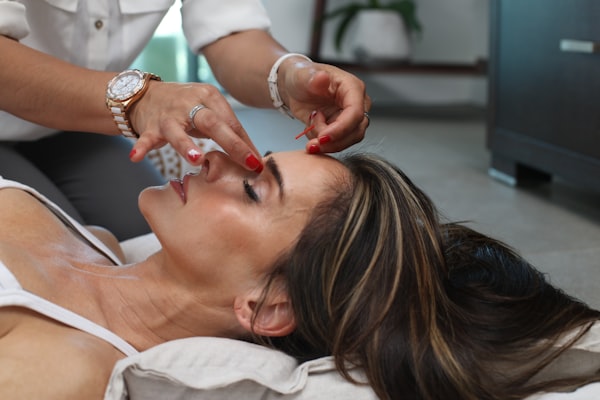 Acupuncture needles placed along meridian points for pain relief